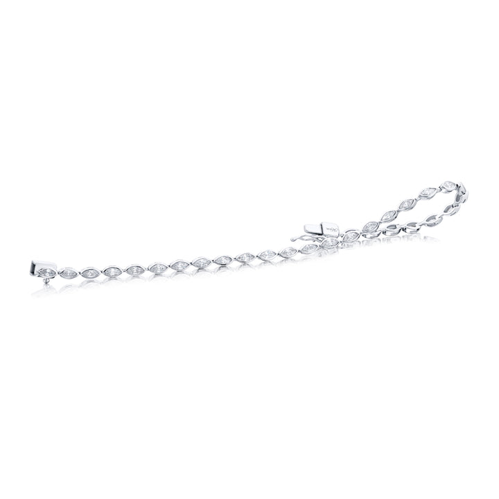 Unbridled Beauty: Our stunning 2.45 ctw. single-row Bezel Diamond Bracelet. These dazzling twenty-nine marquise diamonds are handcrafted in pure platinum.