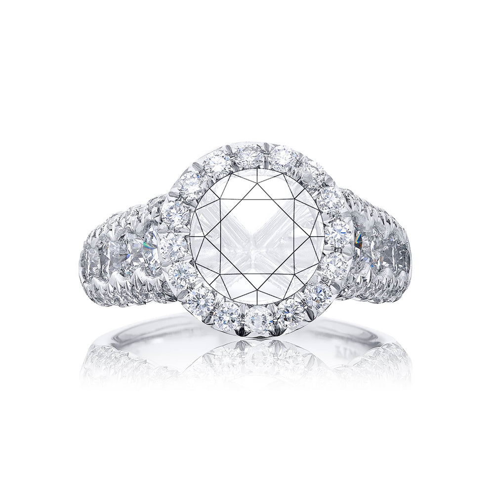 Dazzling Brilliance: Our timeless diamond halo semi-mount. These eight round diamonds are embraced by micro pave diamonds elevating the halo. All handcrafted in pure platinum.