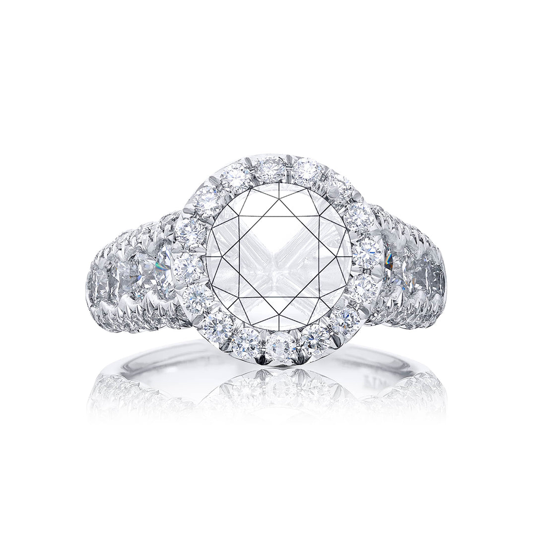 Dazzling Brilliance: Our timeless diamond halo semi-mount. These eight round diamonds are embraced by micro pave diamonds elevating the halo. All handcrafted in pure platinum.