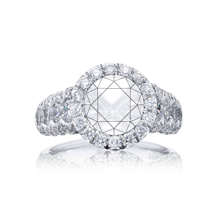 Dazzling Brilliance: Our timeless diamond halo semi-mount. These eight round diamonds are embraced by micro pave diamonds elevating the halo. All handcrafted in pure platinum.