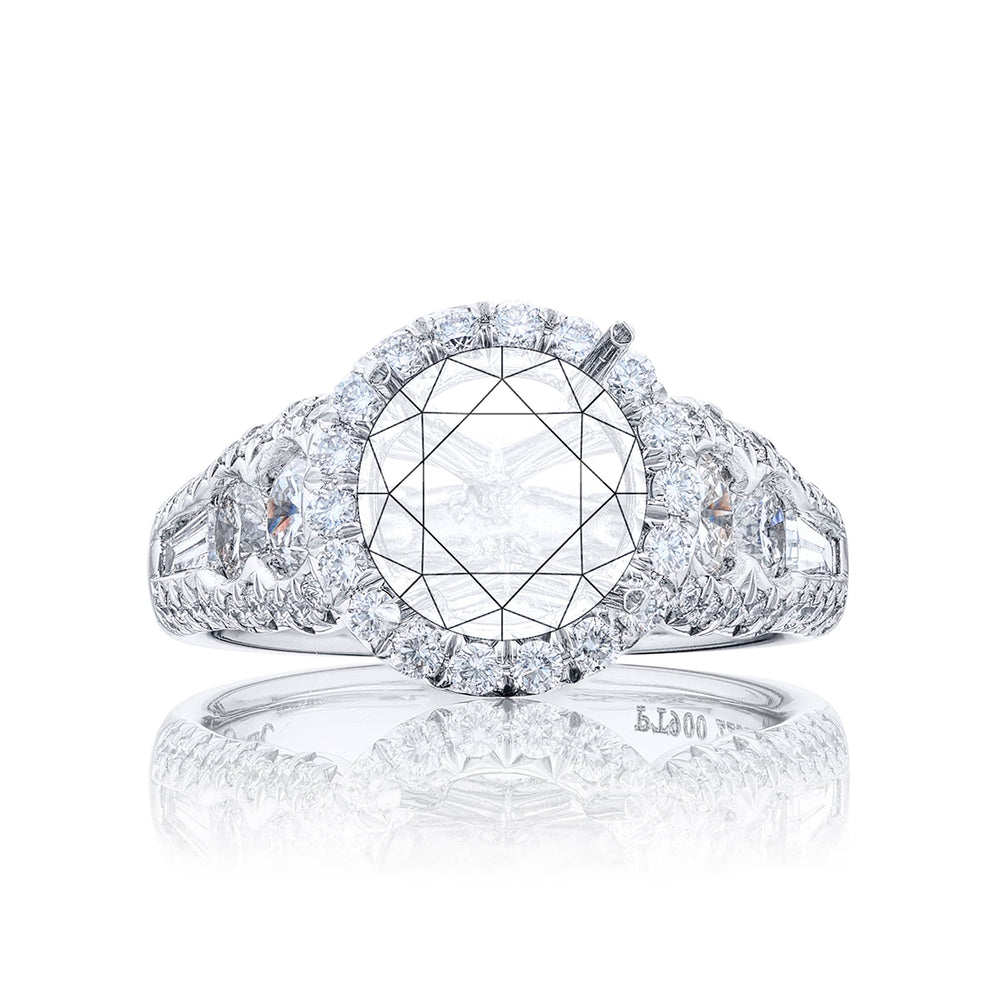 Dazzling Brilliance: Our timeless diamond halo semi-mount. This blend of round and tapered baguette diamonds is embraced by micro pave diamonds elevating the halo. All handcrafted in pure platinum.