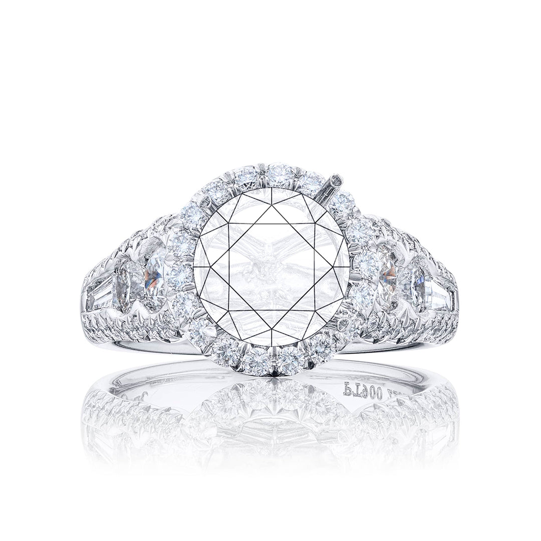 Dazzling Brilliance: Our timeless diamond halo semi-mount. This blend of round and tapered baguette diamonds is embraced by micro pave diamonds elevating the halo. All handcrafted in pure platinum.