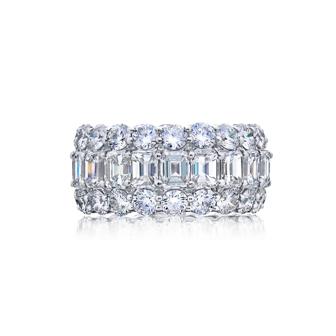 Alluring Eternity: Our beautiful Three-Row Diamond Eternity Band. These stunning emerald-cut diamonds embraced by round diamonds are handcrafted in pure platinum.