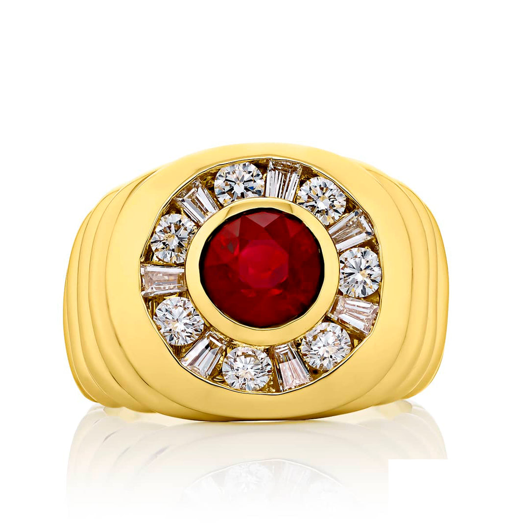 Suave Sophistication: Our dapper 2.87 ct. certified Burmese Ruby Gentleman?s Ring. This stunning round ruby surrounded by dazzling round and tapered baguette diamonds is handcrafted in 18KY gold.