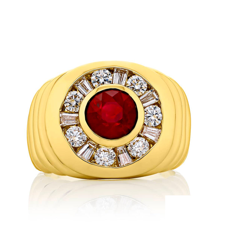Suave Sophistication: Our dapper 2.87 ct. certified Burmese Ruby Gentleman?s Ring. This stunning round ruby surrounded by dazzling round and tapered baguette diamonds is handcrafted in 18KY gold.