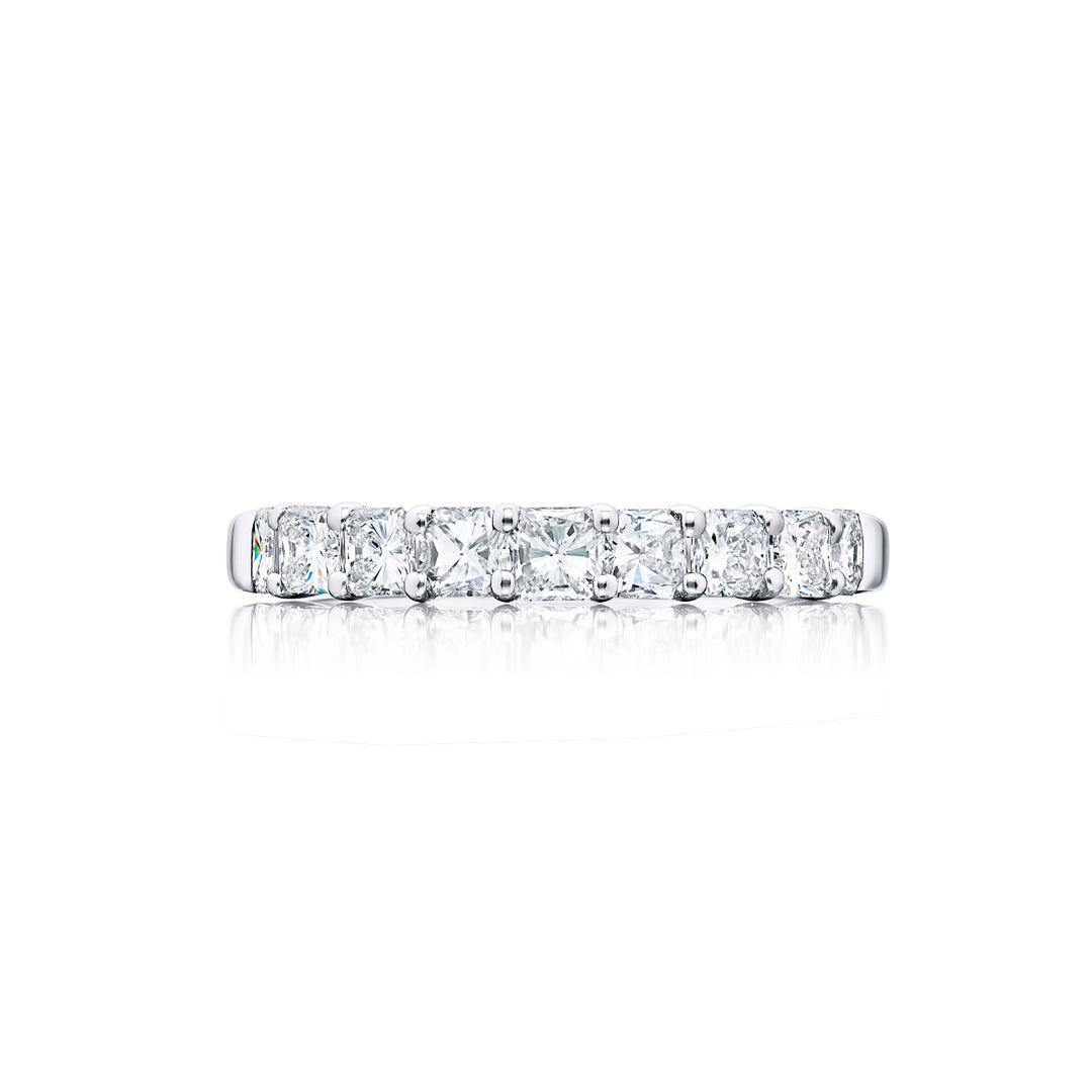 Elegance Elevated: Our classic 1.14 ctw. single row Diamond Band. These nine stunning square emerald-cut diamonds are handcrafted in pure platinum.