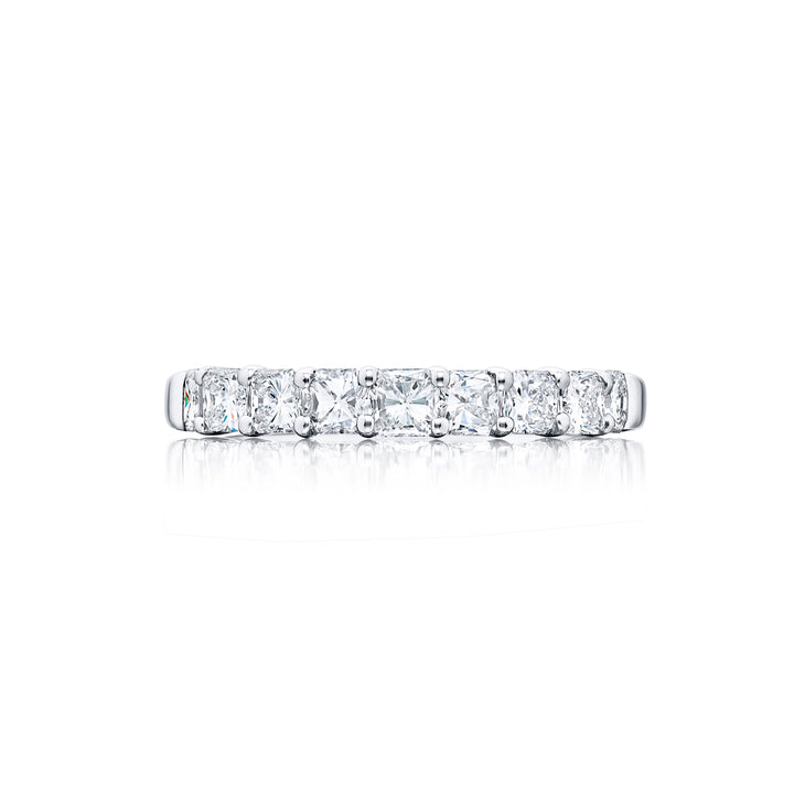 Elegance Elevated: Our classic 1.14 ctw. single row Diamond Band. These nine stunning square emerald-cut diamonds are handcrafted in pure platinum.