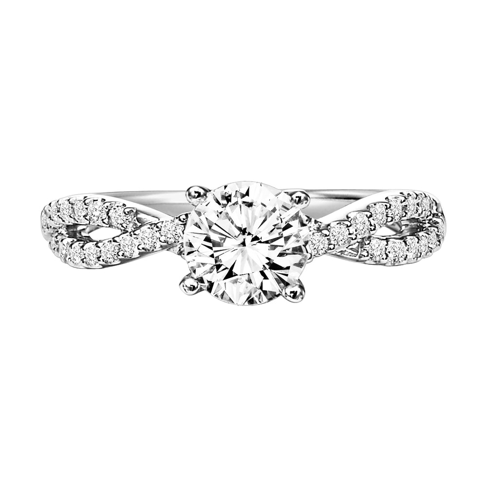 This engagement ring features a diamond prong set band with a delicate twist design elegantly leading up to the round center diamond for an alluring look.  Center Stone is not included.