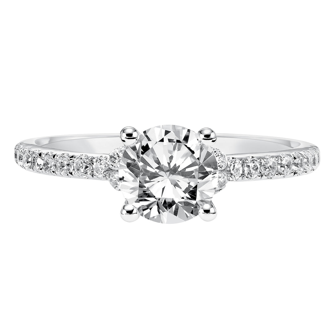 This engagement ring celebrates classic elegance with its delicate diamond prong set band and diamond tiara accent.  Center Stone is not included.