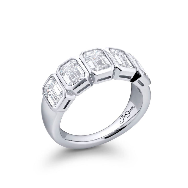Elegance Elevated: Our signature 3.12 ctw. GIA certified Bezel Diamond Band. These five gorgeous emerald-cut diamonds are handcrafted in pure platinum.