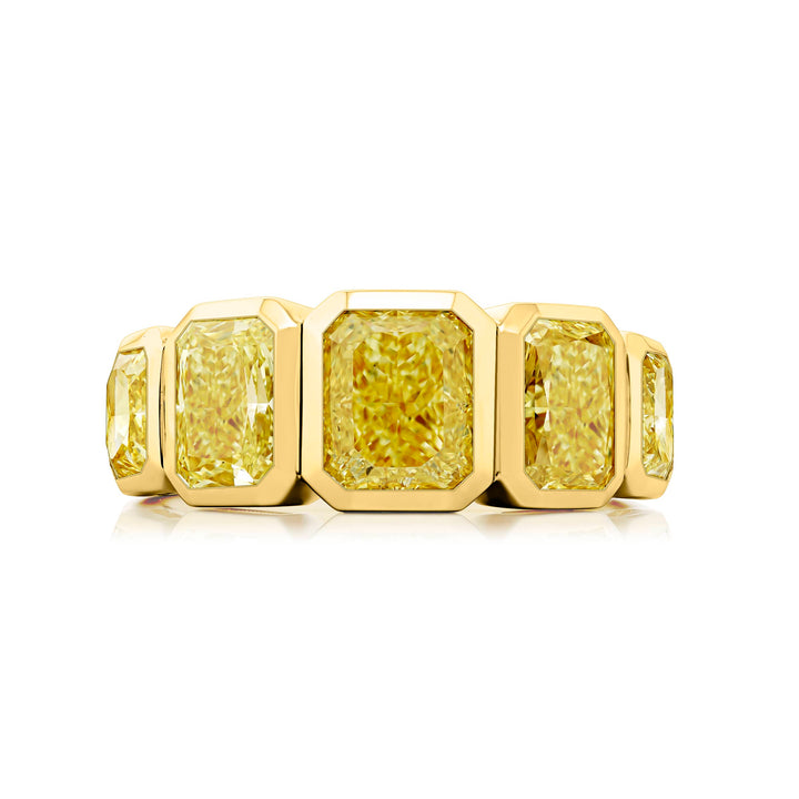 Elegance Elevated: Our stunning 2.53 ctw. GIA certified Bezel Fancy Yellow Diamond Band. These five beautiful radiant-cut fancy yellow diamonds are handcrafted in 18K yellow gold.