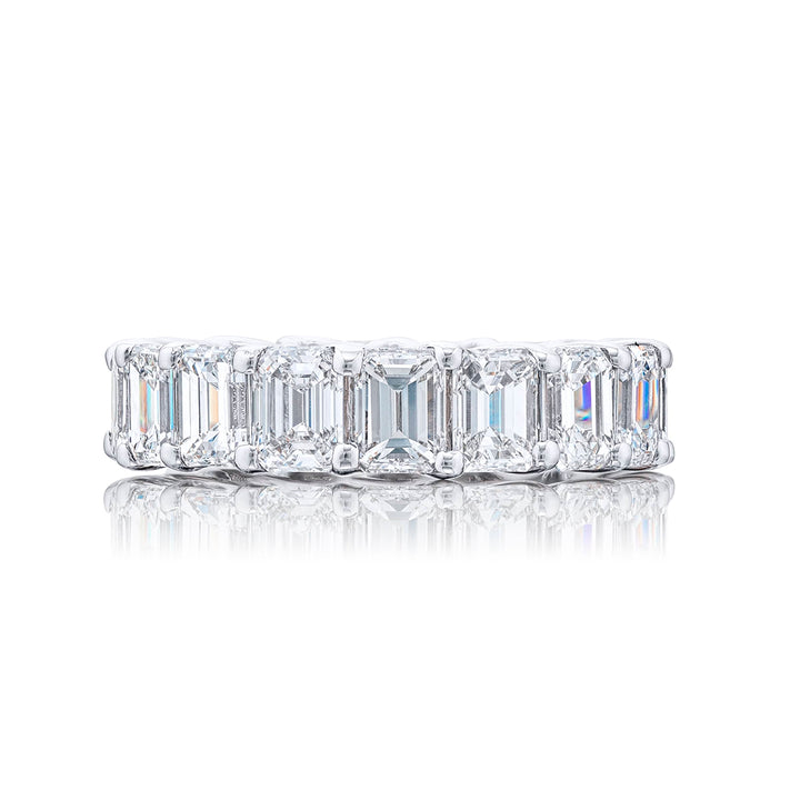 Indulge in pure elegance with our exquisite 17-stone emerald-cut diamond eternity band. Each diamond sparkles brilliantly in a shared prong setting. Meticulously handcrafted in pure platinum it epitomizes everlasting beauty and sophistication.