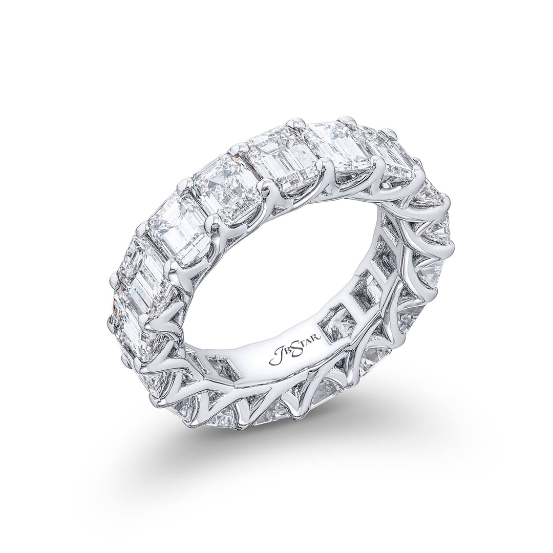 Indulge in pure elegance with our exquisite 17-stone emerald-cut diamond eternity band. Each diamond sparkles brilliantly in a shared prong setting. Meticulously handcrafted in pure platinum it epitomizes everlasting beauty and sophistication.
