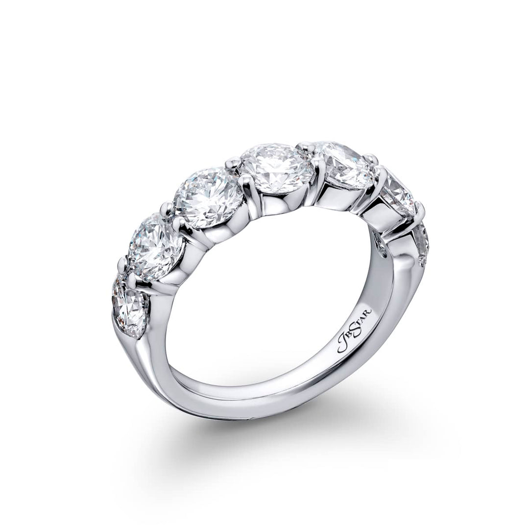 Elegance Elevated: Our stunning 3.14 ctw. GIA certified Diamond Band. These seven dazzling round diamonds are handcrafted in pure platinum.