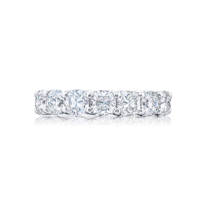 A stunning eternity band featuring 15 perfectly matched cushion-cut diamonds in a shared prong setting meticulously handcrafted from pure platinum.
