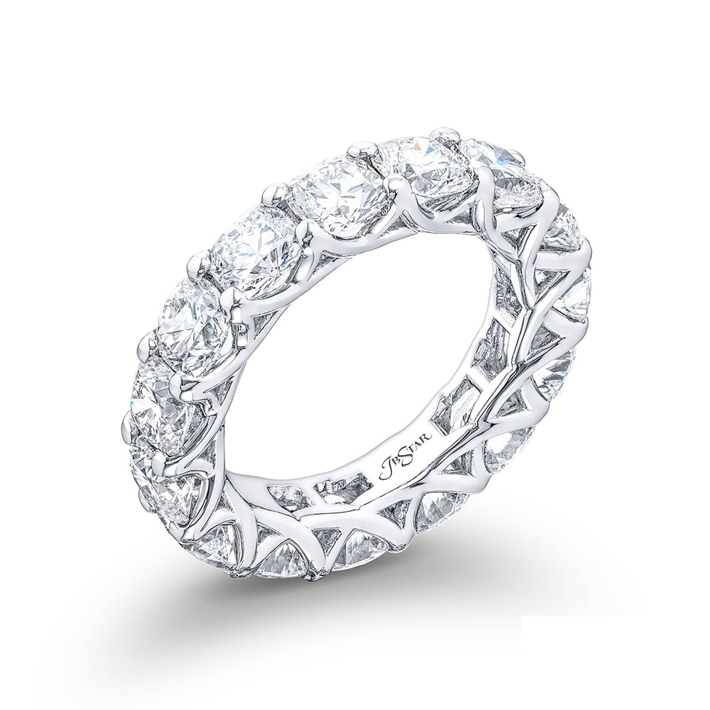 A stunning eternity band featuring 15 perfectly matched cushion-cut diamonds in a shared prong setting meticulously handcrafted from pure platinum.