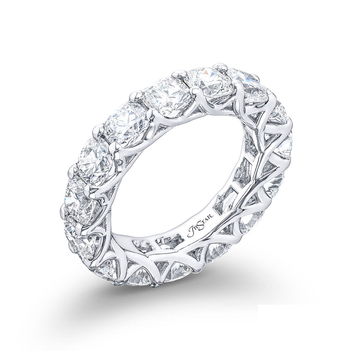A stunning eternity band featuring 15 perfectly matched cushion-cut diamonds in a shared prong setting meticulously handcrafted from pure platinum.