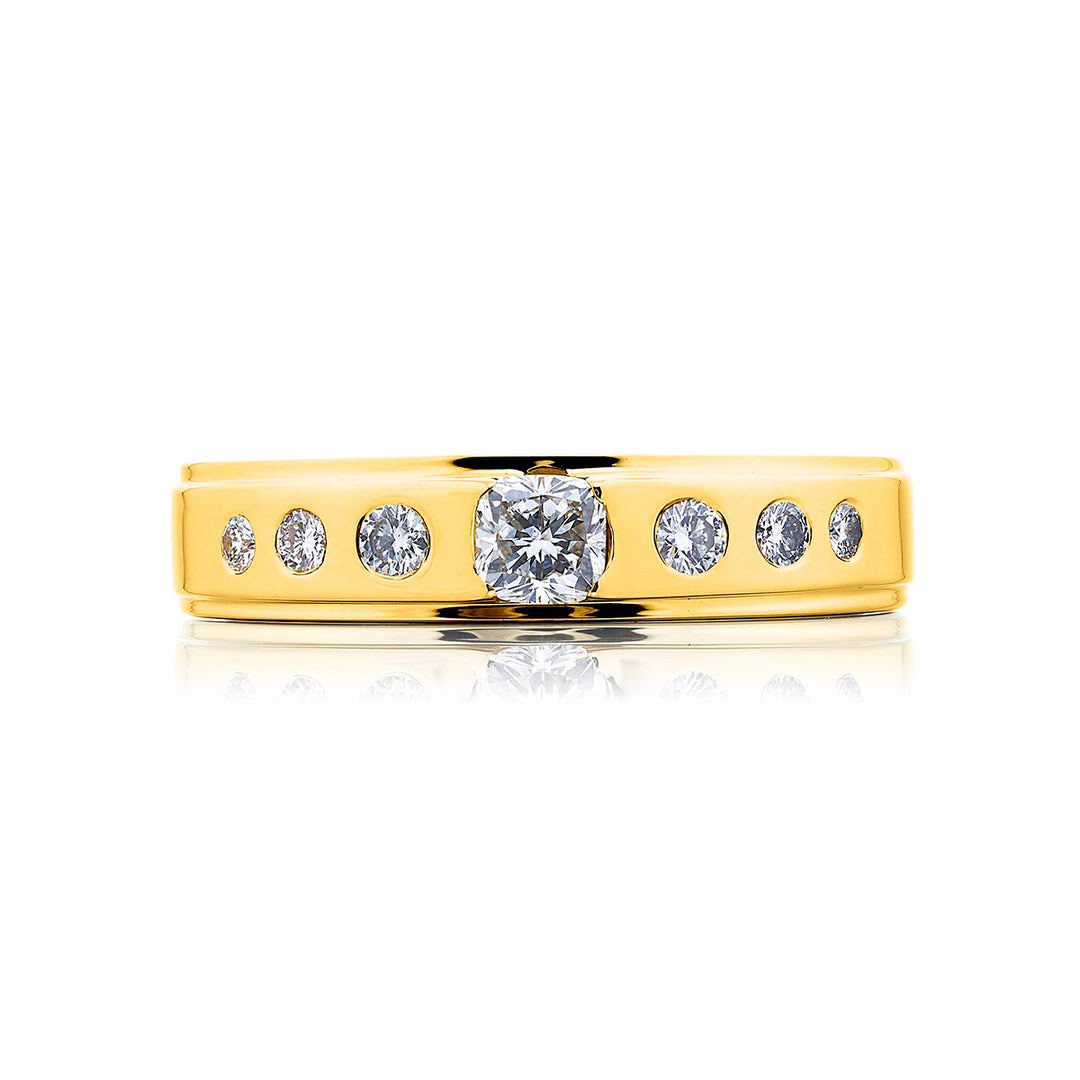 Suave Sophistication: Our dapper Bezel Set Diamond Gentleman?s Band. This cushion-cut diamond center blends with round diamonds and are handcrafted in 18KY gold.