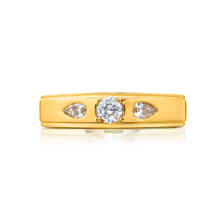 Suave Sophistication: Our dapper Bezel Set Diamond Gentleman?s Band. This round diamond center accompanied by pear-shaped diamonds is handcrafted in 18KY gold.