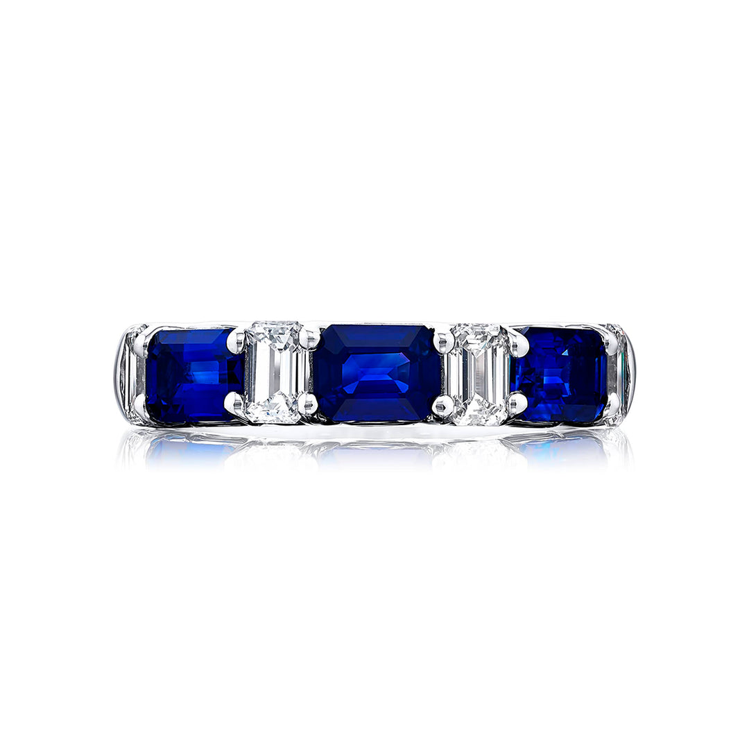 Elegance Elevated: Our classic Sapphire and Diamond Band. These beautiful emerald-cut sapphires blend with emerald-cut diamonds and are handcrafted in pure platinum.