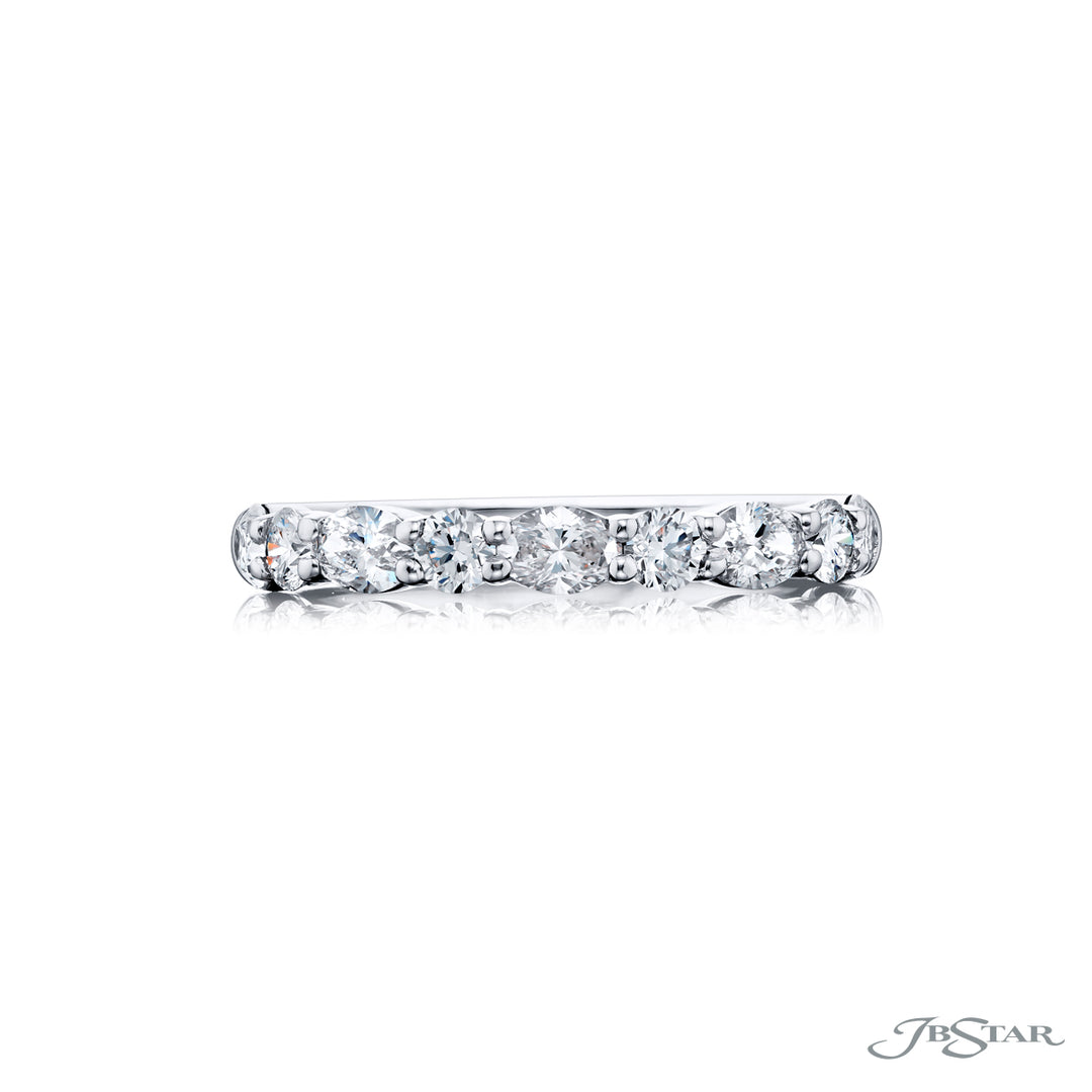Elegance Elevated: Our classic 1.05 ctw. single row East-West Diamond Band. These dazzling oval diamonds accompany round diamonds and are handcrafted in pure platinum.