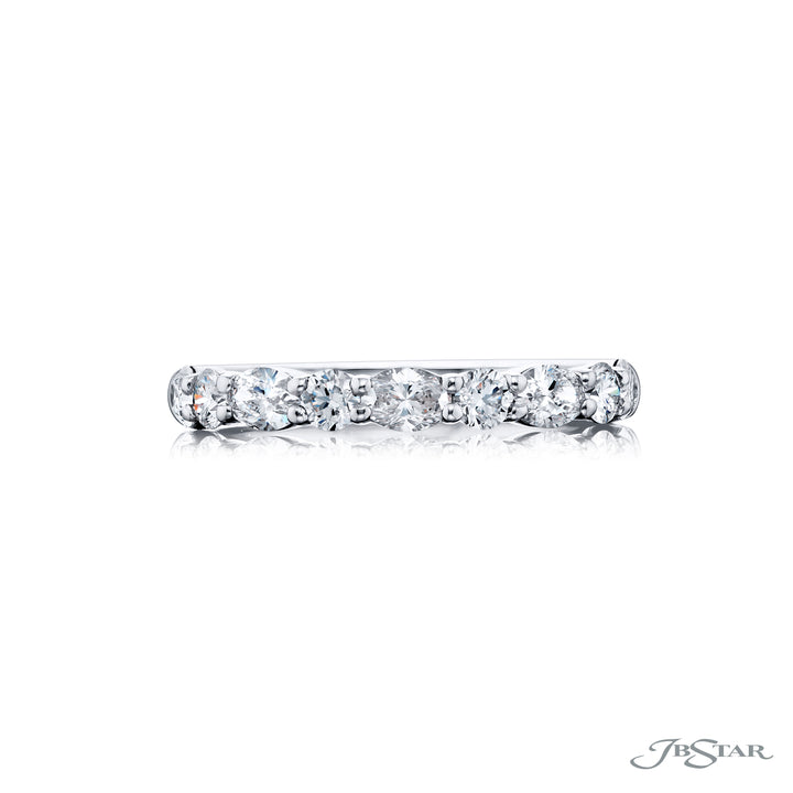 Elegance Elevated: Our classic 1.05 ctw. single row East-West Diamond Band. These dazzling oval diamonds accompany round diamonds and are handcrafted in pure platinum.