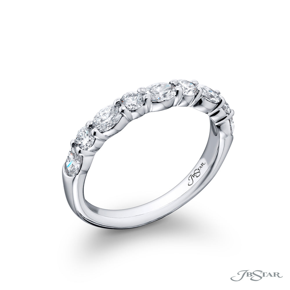 Elegance Elevated: Our classic 1.05 ctw. single row East-West Diamond Band. These dazzling oval diamonds accompany round diamonds and are handcrafted in pure platinum.
