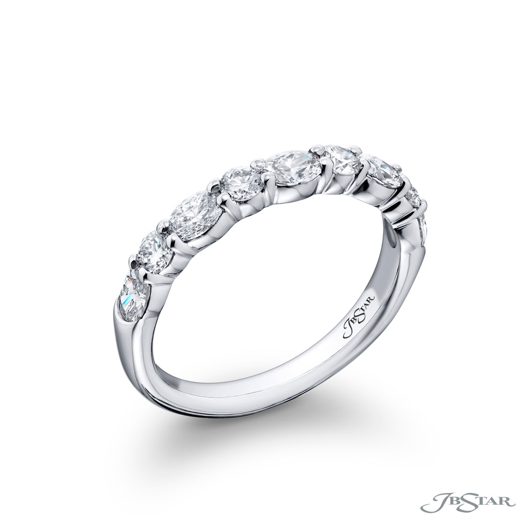 Elegance Elevated: Our classic 1.05 ctw. single row East-West Diamond Band. These dazzling oval diamonds accompany round diamonds and are handcrafted in pure platinum.