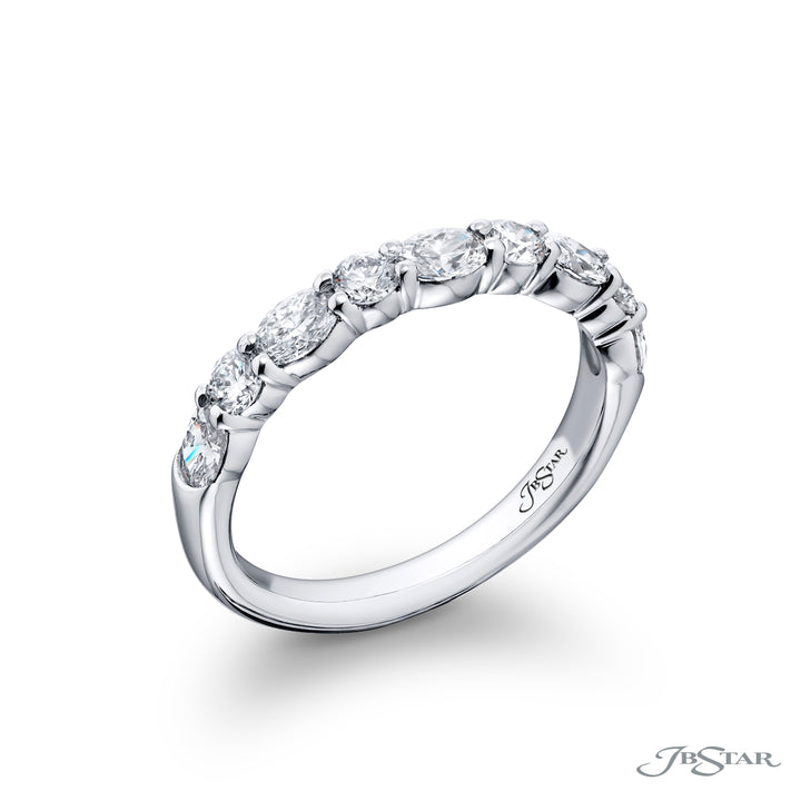 Elegance Elevated: Our classic 1.05 ctw. single row East-West Diamond Band. These dazzling oval diamonds accompany round diamonds and are handcrafted in pure platinum.