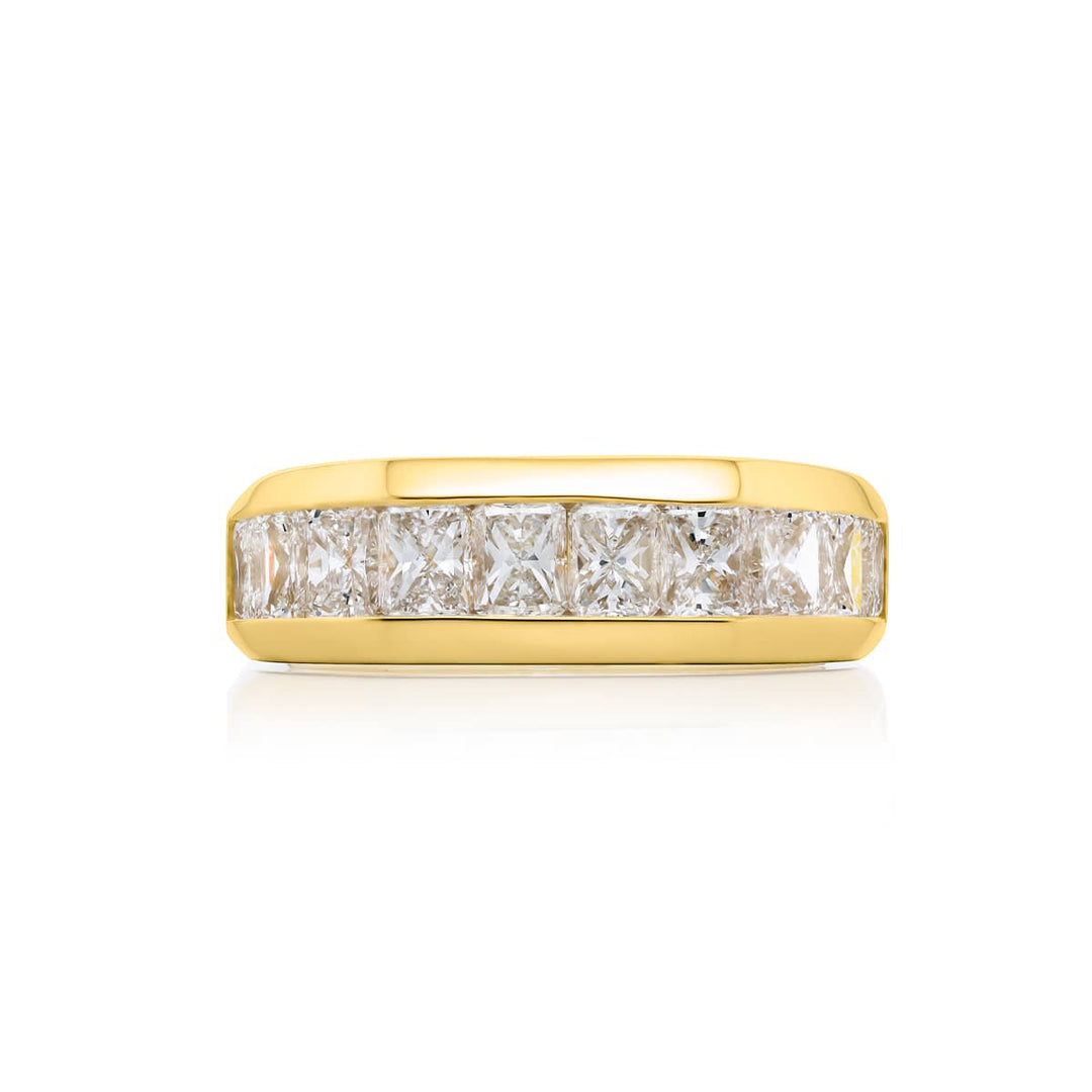Suave Sophistication: Our dapper 3.76 ctw. Channel Set Diamond Gentleman?s Band. These twelve beautiful radiant-cut diamonds are handcrafted in 18KY gold.