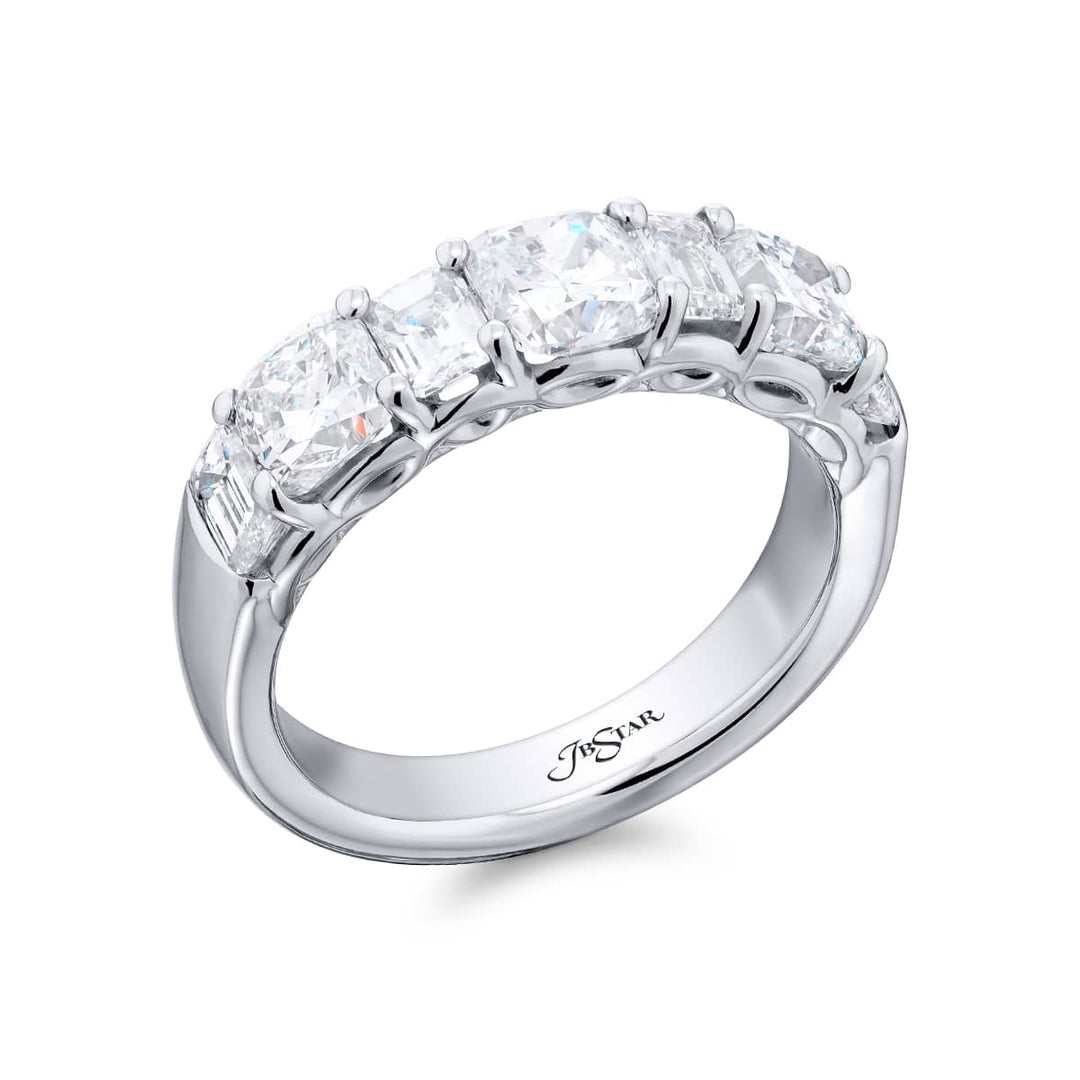 Elegance Elevated: Our signature 2.75 ctw. Diamond Band. These beautiful emerald-cut diamonds blended with cushion-cut diamonds are handcrafted in pure platinum.