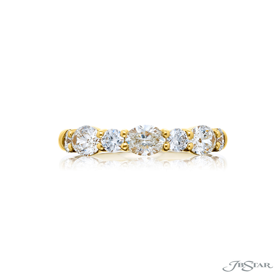 Elegance Elevated: Our classic 1.11 ctw. East-West single row Diamond Band. These beautiful oval diamonds accompany round diamonds and are handcrafted in 18KY gold.