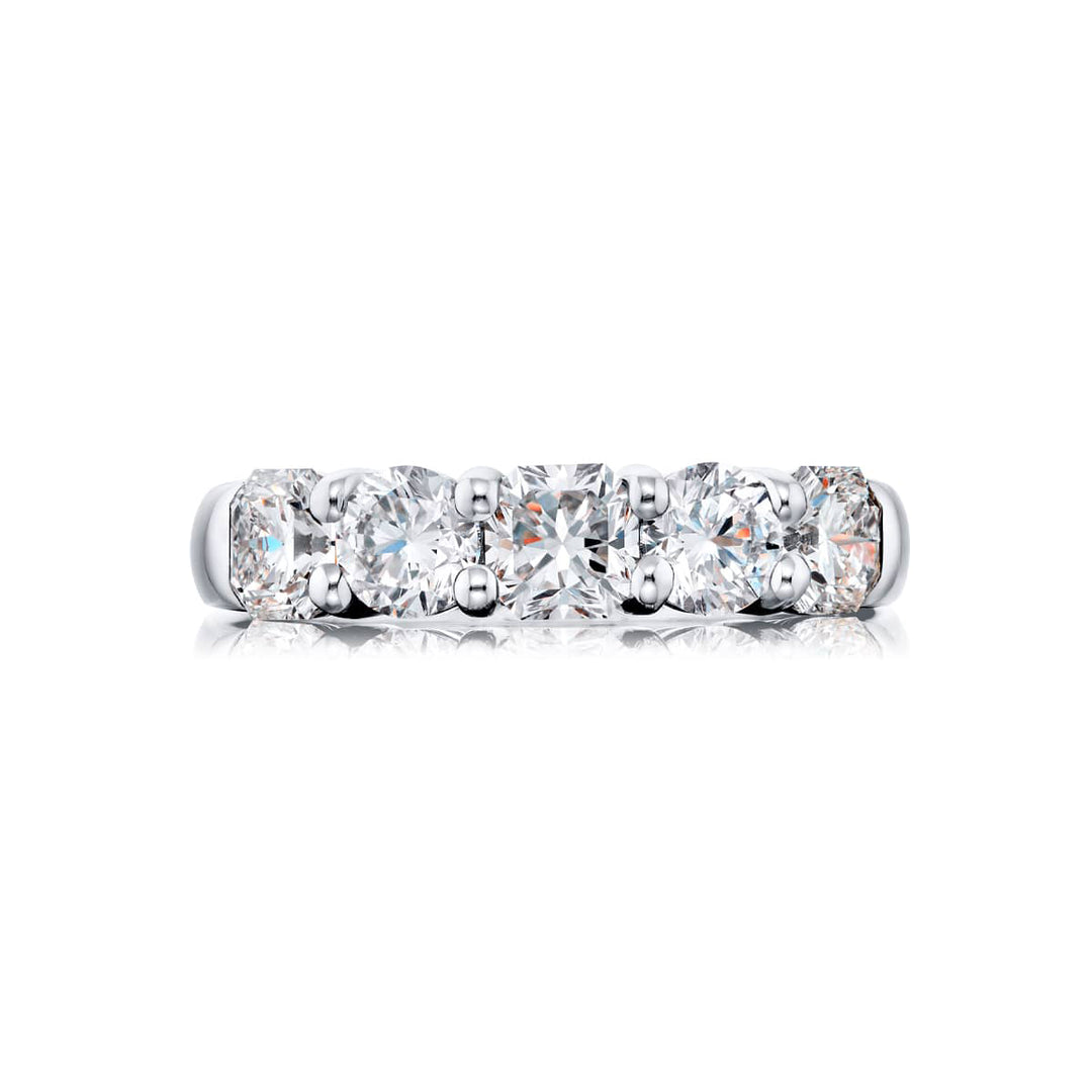 Elegance Elevated: Our classic single row Diamond Band. These stunning carmel-cut and round diamonds are handcrafted in pure platinum.