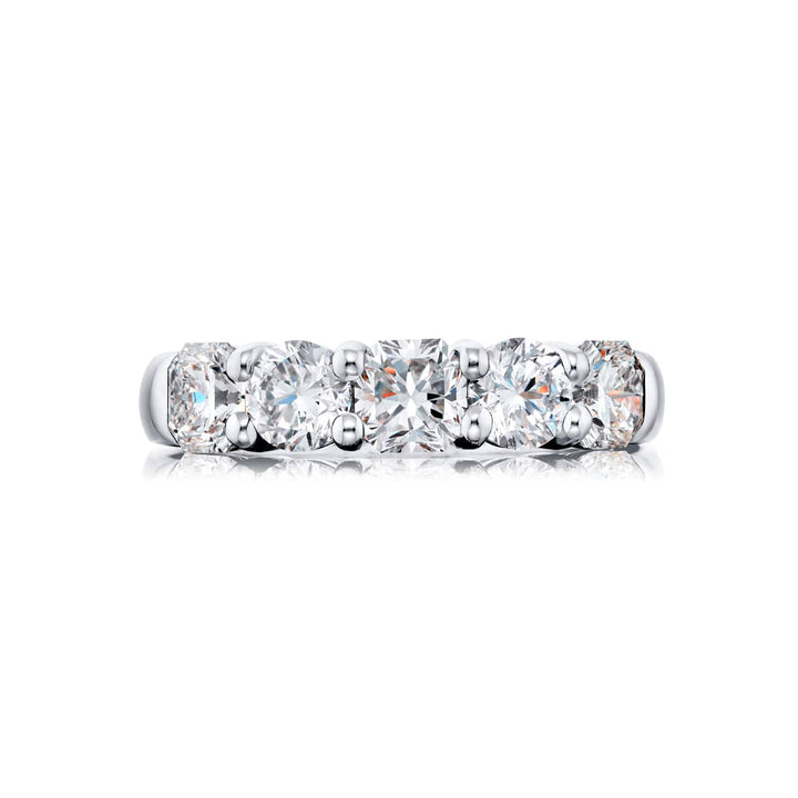 Elegance Elevated: Our classic single row Diamond Band. These stunning carmel-cut and round diamonds are handcrafted in pure platinum.