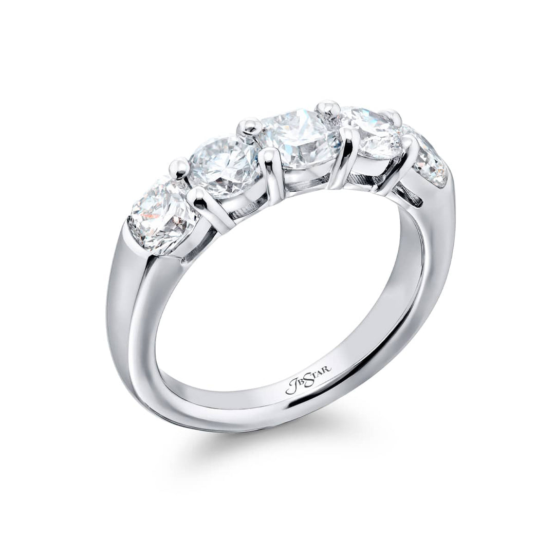 Elegance Elevated: Our classic single row Diamond Band. These stunning carmel-cut and round diamonds are handcrafted in pure platinum.