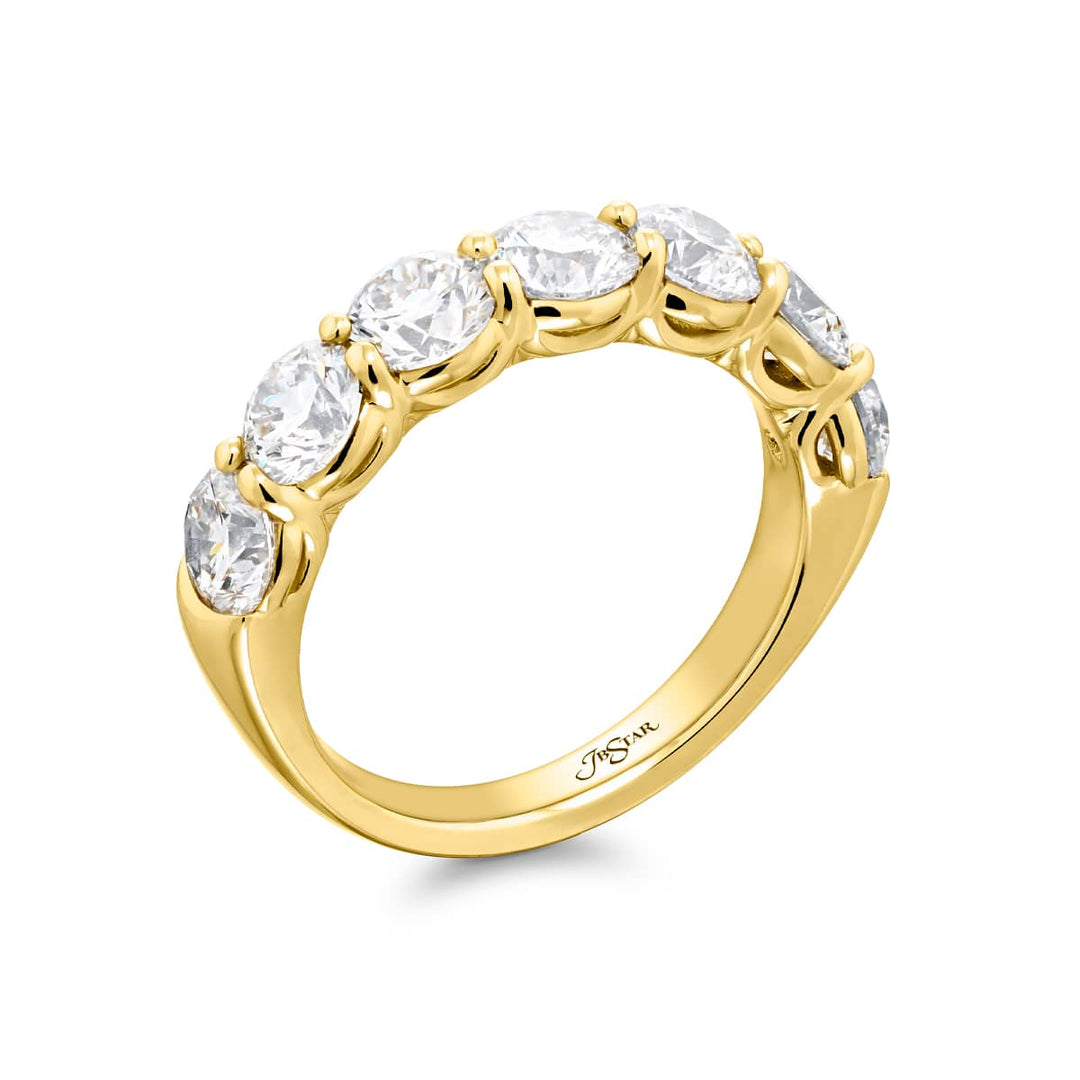 Elegance Elevated: Our signature 2.80 ctw. Diamond Band. These seven beautiful round diamonds are handcrafted in 18KY gold.