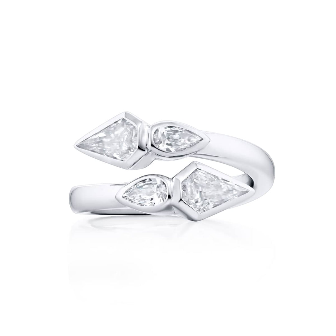 Dazzling Brilliance: Our unique Bezel Twogether Diamond Ring. These stunning kite diamonds accompanied by dazzling pear-shaped diamonds are handcrafted in pure platinum.