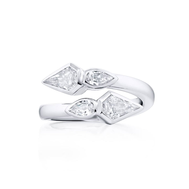 Dazzling Brilliance: Our unique Bezel Twogether Diamond Ring. These stunning kite diamonds accompanied by dazzling pear-shaped diamonds are handcrafted in pure platinum.