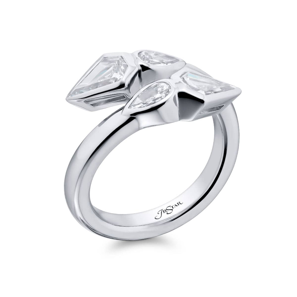 Dazzling Brilliance: Our unique Bezel Twogether Diamond Ring. These stunning kite diamonds accompanied by dazzling pear-shaped diamonds are handcrafted in pure platinum.