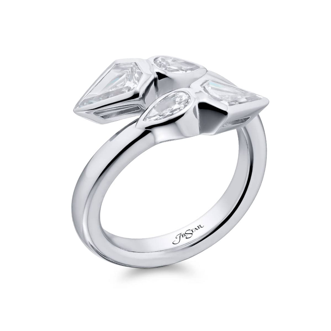 Dazzling Brilliance: Our unique Bezel Twogether Diamond Ring. These stunning kite diamonds accompanied by dazzling pear-shaped diamonds are handcrafted in pure platinum.