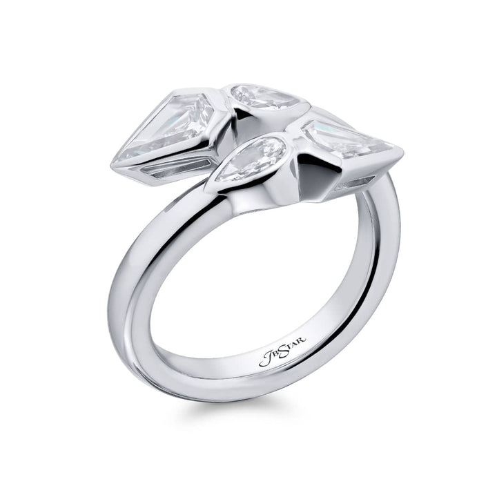 Dazzling Brilliance: Our unique Bezel Twogether Diamond Ring. These stunning kite diamonds accompanied by dazzling pear-shaped diamonds are handcrafted in pure platinum.