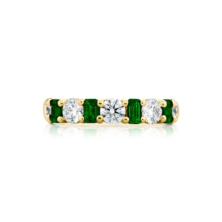 Elegance Elevated: Our signature Emerald and Diamond Band. These beautiful emerald-cut emeralds blended with dazzling round diamonds are handcrafted in 18KY gold.