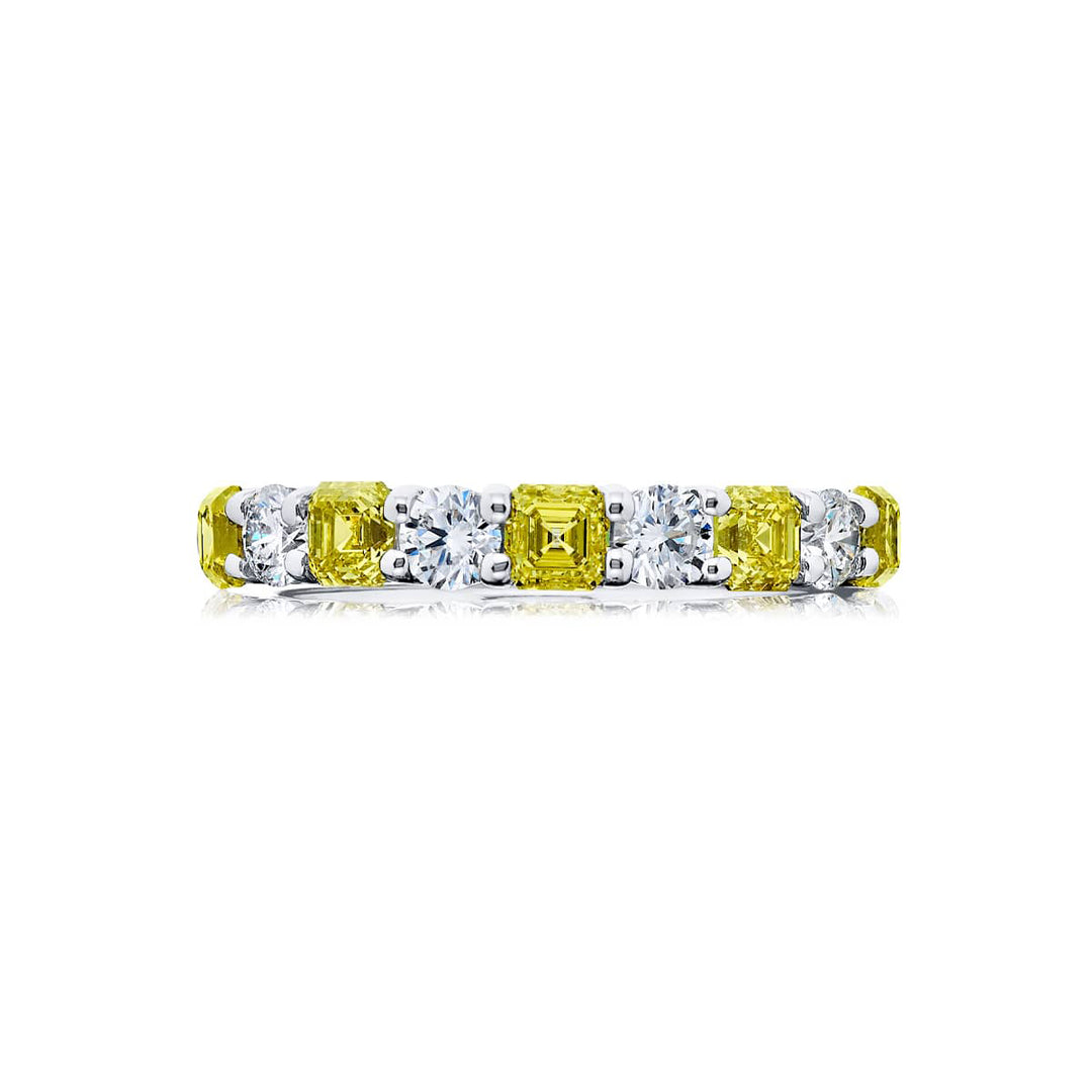 Elegance Elevated: Our classic Fancy Yellow and White Diamond Band. These beautiful fancy yellow square emerald-cut blended with round white diamonds are handcrafted in pure platinum and 18KY gold.