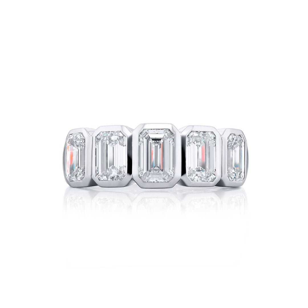 Elegance Elevated: Our stunning 3.07 ctw. Bezel Diamond Band. These five beautiful emerald-cut diamonds are handcrafted in pure platinum.