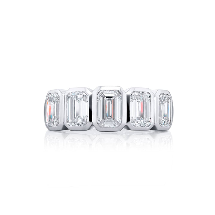 Elegance Elevated: Our stunning 3.07 ctw. Bezel Diamond Band. These five beautiful emerald-cut diamonds are handcrafted in pure platinum.