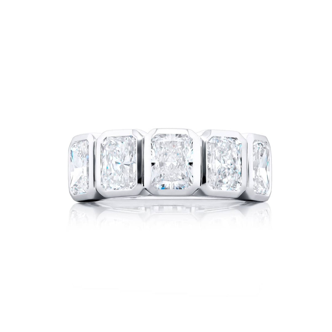 Elegance Elevated: Our stunning 3.55 ctw. GIA certified Bezel Diamond Band. These five beautiful radiant-cut diamonds are handcrafted in pure platinum.