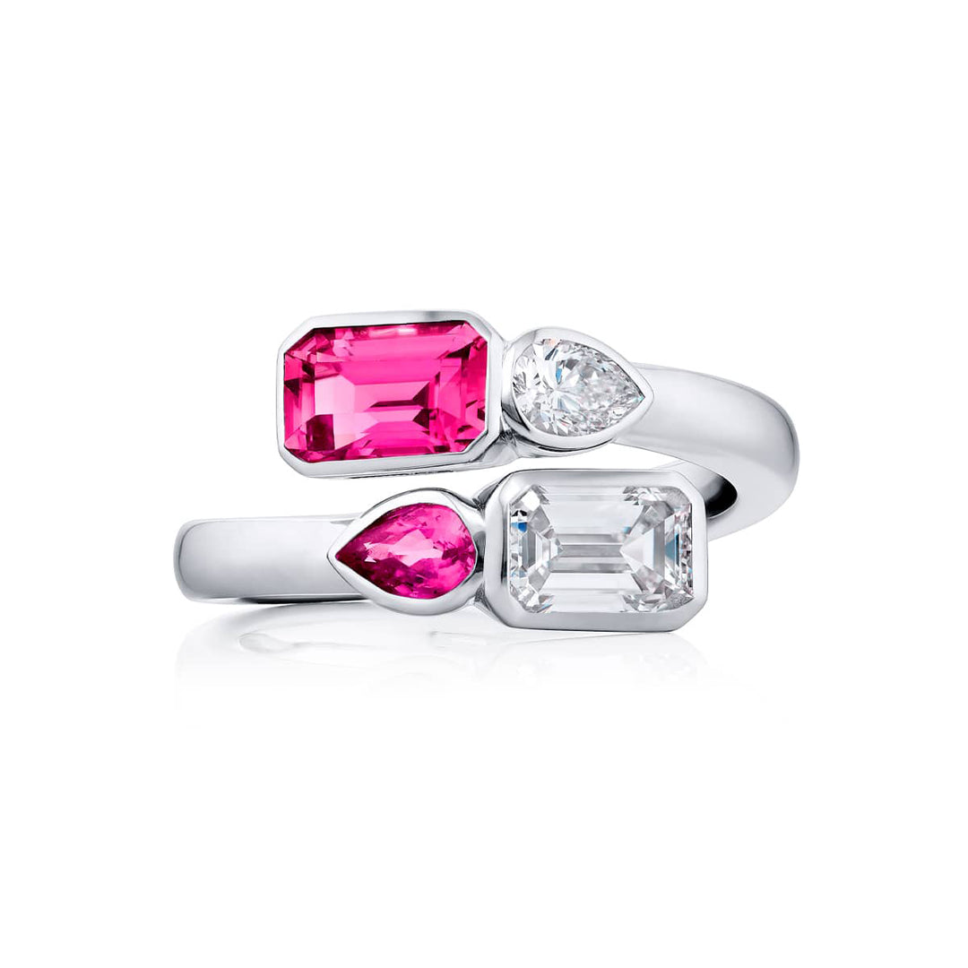 Breathtaking Radiance: Our unique GIA certified Bezel Twogether Pink Sapphire and Diamond Ring. This stunning emerald-cut diamond and pink sapphire accompanied by a shimmering pear-shaped diamond and pink sapphire are handcrafted in pure platinum.
