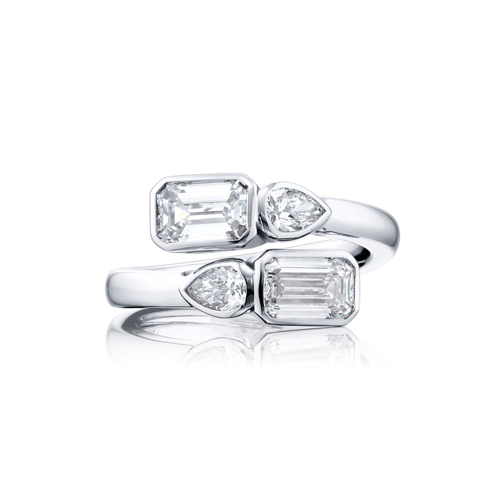 Dazzling Brilliance: Our unique 1.63 ctw. GIA certified Bezel Twogether Diamond Ring. These stunning emerald-cut diamonds accompanied by dazzling pear-shaped diamonds are handcrafted in pure platinum.