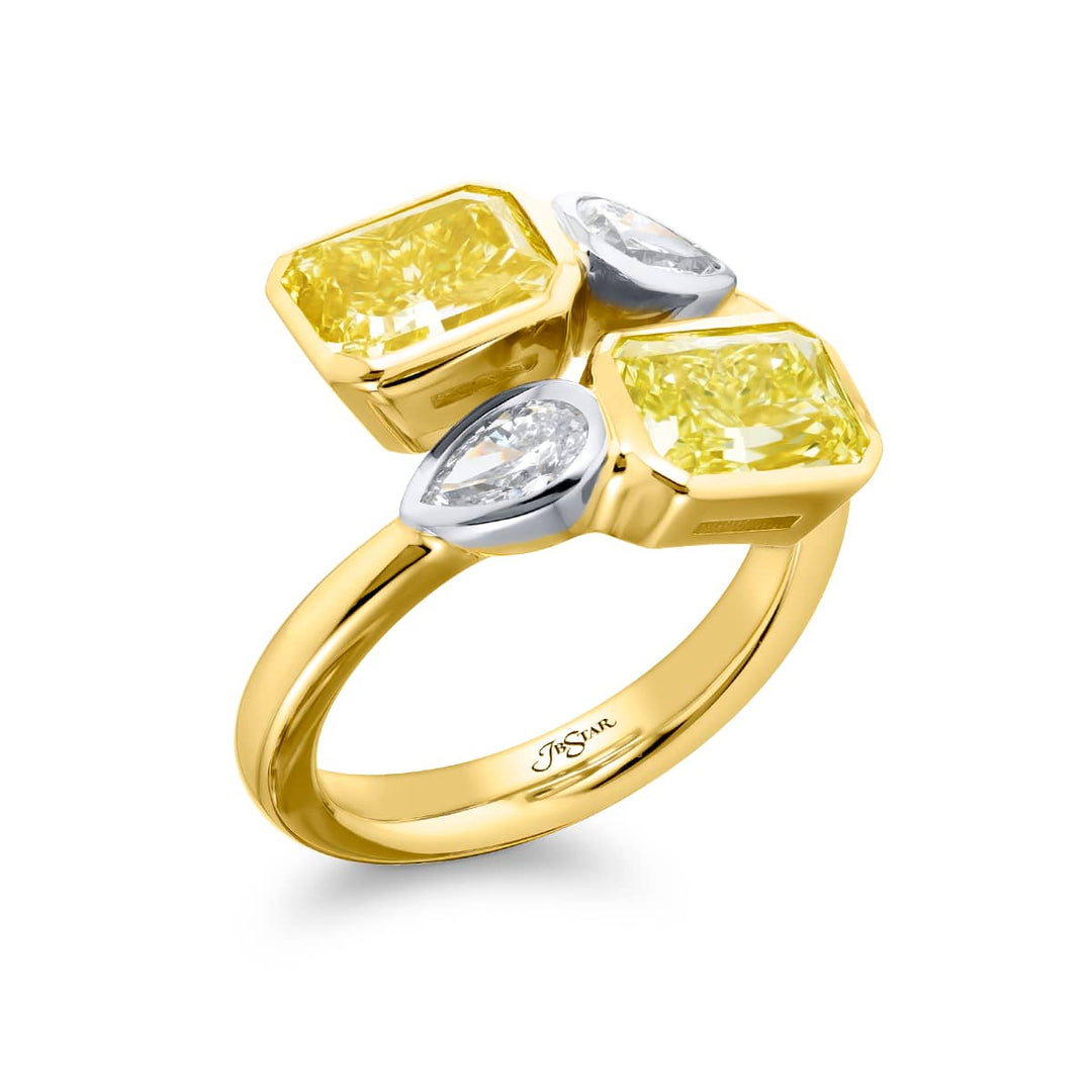 Dazzling Brilliance: Our unique 3.18 ctw. GIA certified Bezel Twogether Fancy Yellow Diamond Ring. These stunning radiant-cut fancy yellow diamonds accompanied by dazzling pear-shaped diamonds are handcrafted in 18KY gold and pure platinum.