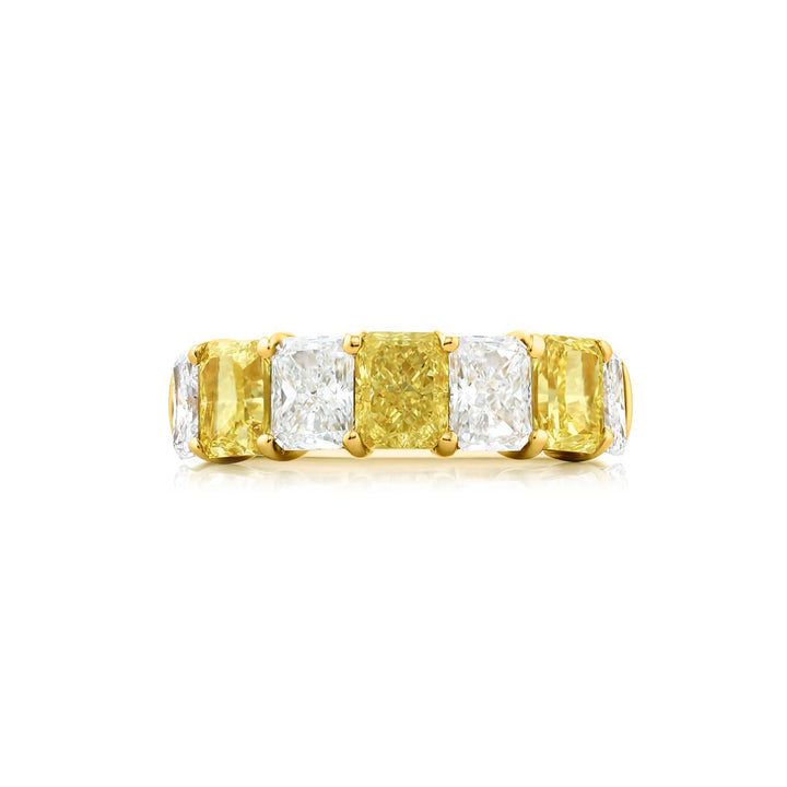 Elegance Elevated: Our classic single row Fancy Yellow & White Diamond Band. These radiant-cut fancy yellow diamonds accompany radiant-cut white diamonds and are handcrafted in 18KY gold.